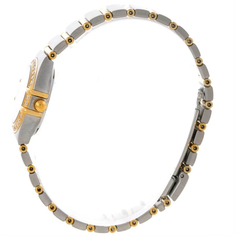 The image shows a side view of the Omega 1267.75.00 Women
s Steel and Gold (two tone) Mother of Pearl Dial 1267.75.00 Women
s Steel and Gold (two tone) Mother of Pearl Dial Constellation My Choice Steel Gold Diamond Watch 1267.75.00, highlighting its band and case.