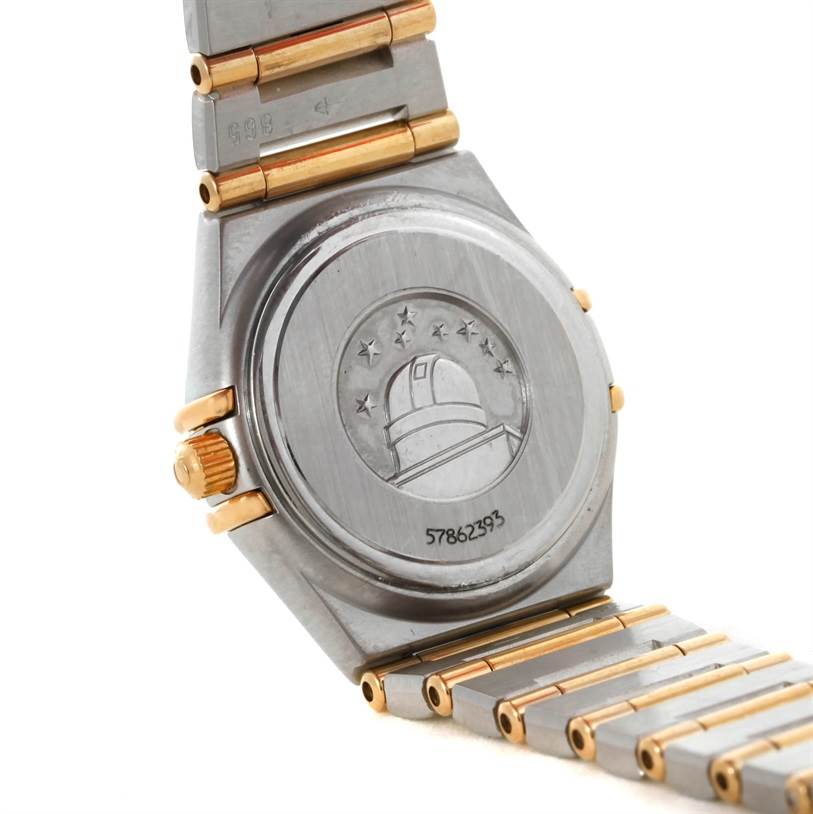 The image shows the back case and part of the bracelet of the Omega 1267.75.00 Women
s Steel and Gold (two tone) Mother of Pearl Dial 1267.75.00 Women
s Steel and Gold (two tone) Mother of Pearl Dial Constellation My Choice Steel Gold Diamond Watch 1267.75.00.