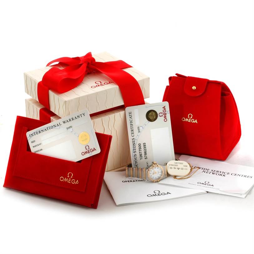 The image shows the Omega 1267.75.00 Women
s Steel and Gold (two tone) Mother of Pearl Dial 1267.75.00 Women
s Steel and Gold (two tone) Mother of Pearl Dial Constellation My Choice Steel Gold Diamond Watch 1267.75.00, along with packaging, warranty cards, and a case.