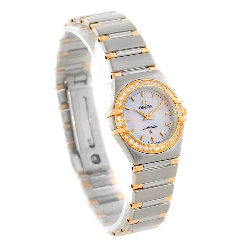 The image shows the Omega 56945066 Women
s Steel and Gold (two tone) Mother of Pearl Dial 56945066 Women
s Steel and Gold (two tone) Mother of Pearl Dial Constellation Mini Steel and Gold Diamond Watch at a three-quarter angle with its face, bezel, and bracelet visible.