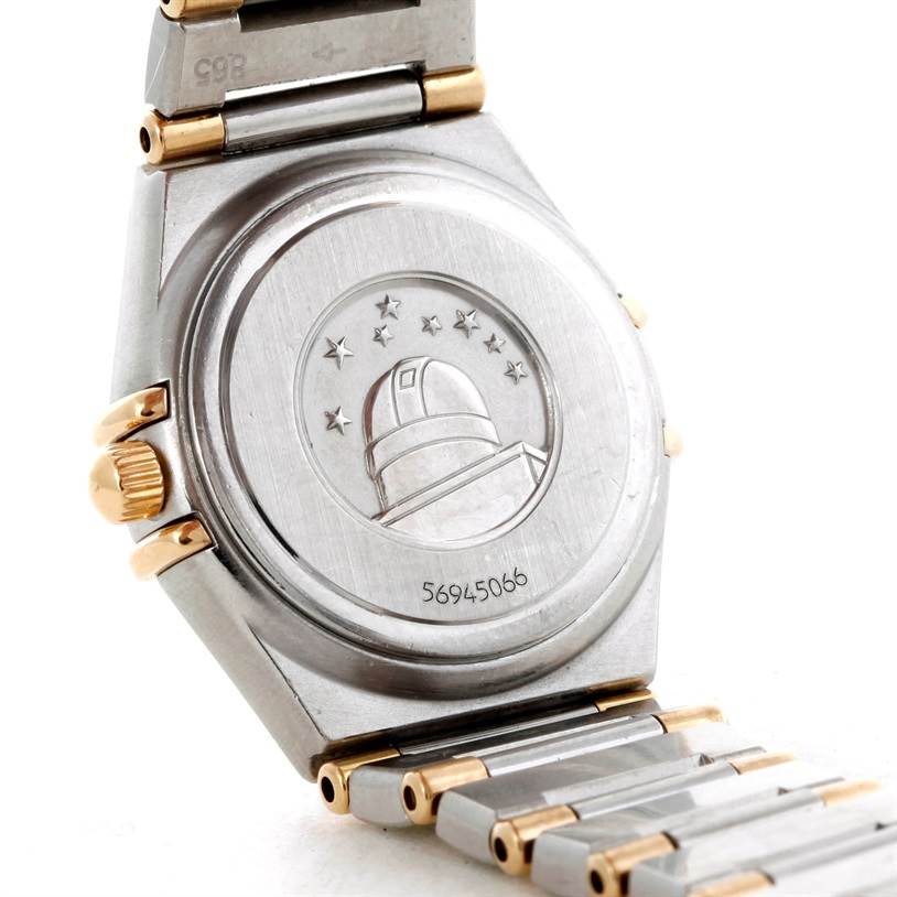 The image shows the back case and part of the bracelet of the Omega 56945066 Women
s Steel and Gold (two tone) Mother of Pearl Dial 56945066 Women
s Steel and Gold (two tone) Mother of Pearl Dial Constellation Mini Steel and Gold Diamond Watch.