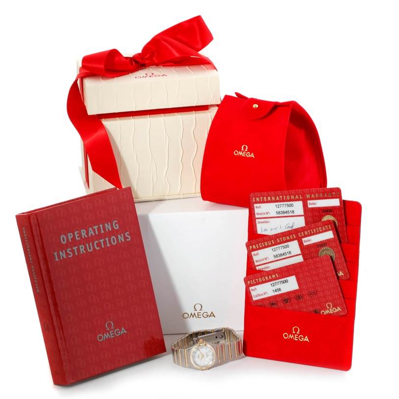 The image shows the Omega 1277.75.00 Women
s Steel and Gold (two tone) Mother of Pearl Dial 1277.75.00 Women
s Steel and Gold (two tone) Mother of Pearl Dial Constellation My Choice Steel Gold Diamond Watch 1277.75.00, its packaging, operating instructions, and warranty cards.