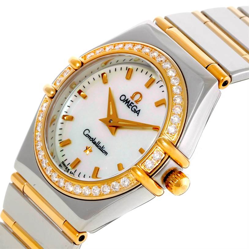 The image shows the dial, crown, and part of the band of the Omega 1277.70.00 Women
s Steel and Gold (two tone) Mother of Pearl Dial 1277.70.00 Women
s Steel and Gold (two tone) Mother of Pearl Dial Constellation My Choice Steel Gold Diamond Watch 1277.70.00 at an angled view.