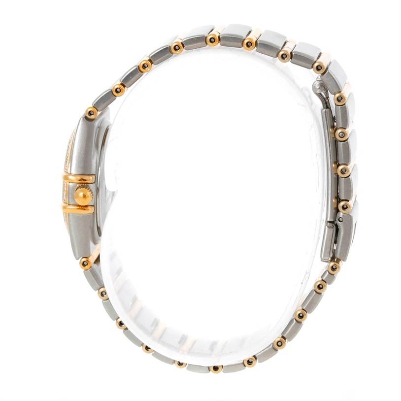 The image shows a side view of the Omega 1267.70.00 Women
s Steel and Gold (two tone) Mother of Pearl Dial 1267.70.00 Women
s Steel and Gold (two tone) Mother of Pearl Dial Constellation My Choice Mini Steel Gold Diamond Watch 1267.70.00, highlighting its bracelet and bezel.