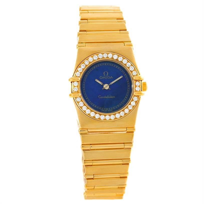 The image shows a front view of the Omega Women
s Blue Dial Women
s Blue Dial Constellation 18K Yellow Gold Diamond Lapis Dial Watch, highlighting the dial, bezel, and band.