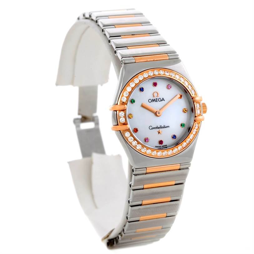 The image shows an angled view of the Omega 1358.79.00 Women
s Steel and Gold (two tone) Mother of Pearl Dial 1358.79.00 Women
s Steel and Gold (two tone) Mother of Pearl Dial Constellation Iris Steel Rose Gold Multi Stone Watch 1358.79.00, highlighting the watch face and bracelet.
