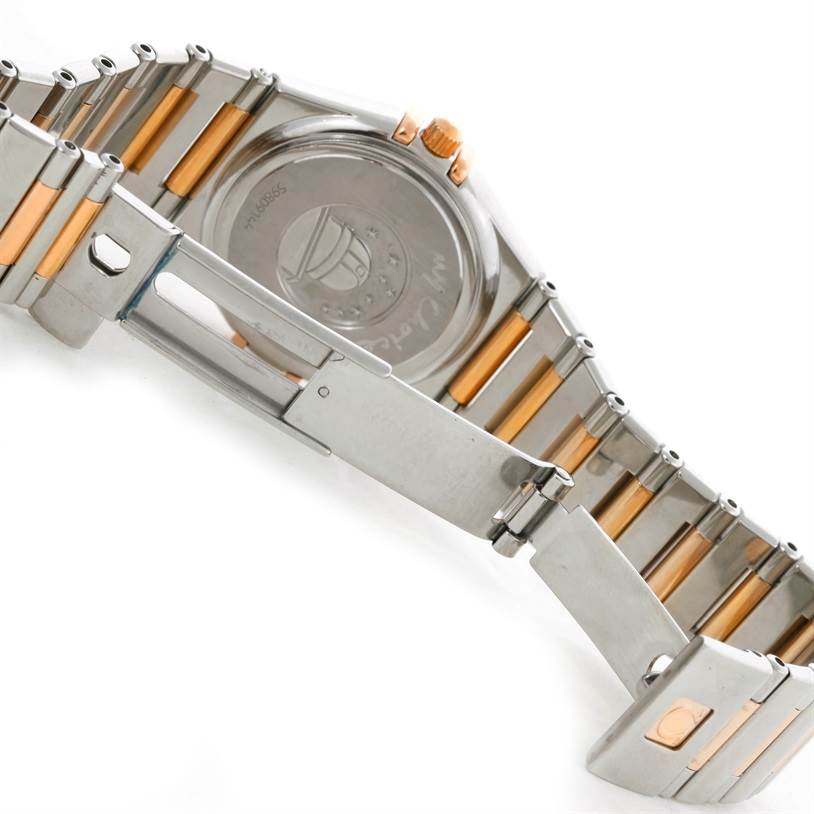 The image shows the back case and two-tone steel and rose gold bracelet of the Omega 1358.79.00 Women
s Steel and Gold (two tone) Mother of Pearl Dial 1358.79.00 Women
s Steel and Gold (two tone) Mother of Pearl Dial Constellation Iris Steel Rose Gold Multi Stone Watch 1358.79.00.