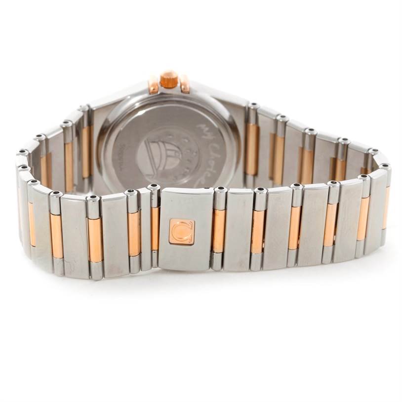 The image shows the back view of the Omega 1358.79.00 Women
s Steel and Gold (two tone) Mother of Pearl Dial 1358.79.00 Women
s Steel and Gold (two tone) Mother of Pearl Dial Constellation Iris Steel Rose Gold Multi Stone Watch 1358.79.00, focusing on its bracelet and clasp.