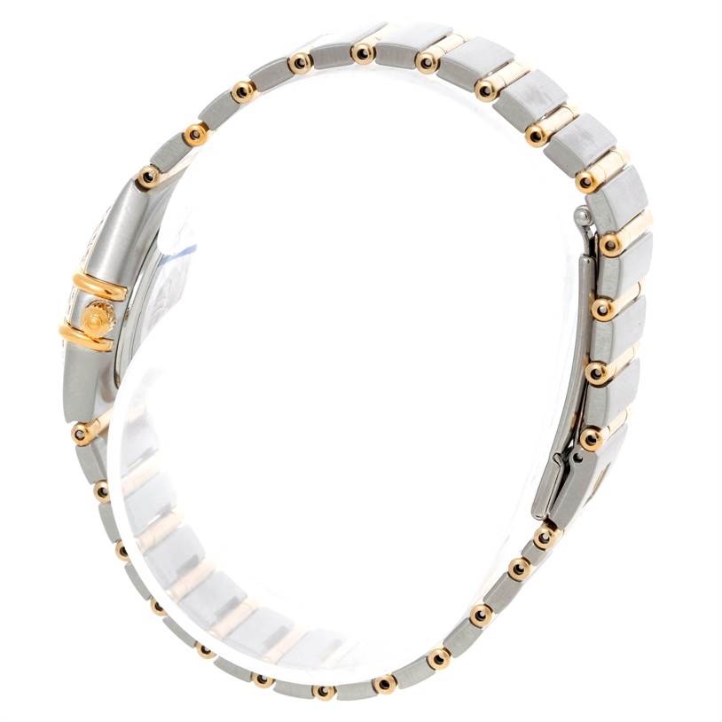This side view shows the bracelet and the clasp of the Omega 1267.70.00 Women
s Steel and Gold (two tone) Mother of Pearl Dial 1267.70.00 Women
s Steel and Gold (two tone) Mother of Pearl Dial Constellation My Choice Mini Steel Gold Diamond Watch 1267.70.00.