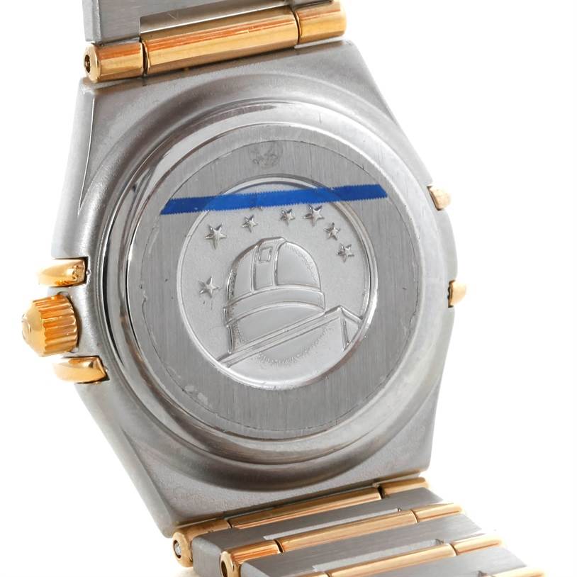 The image shows the case back of the Omega 1267.70.00 Women
s Steel and Gold (two tone) Mother of Pearl Dial 1267.70.00 Women
s Steel and Gold (two tone) Mother of Pearl Dial Constellation My Choice Mini Steel Gold Diamond Watch 1267.70.00.