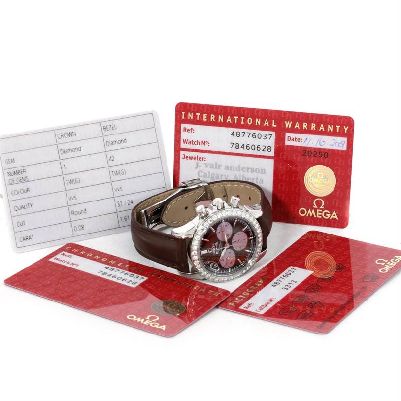 The image shows the Omega 4877.60.37 Women
s Stainless Steel Mother of Pearl Dial 4877.60.37 Women
s Stainless Steel Mother of Pearl Dial DeVille Co-Axial 1.61CT Diamond Ladies Watch 4877.60.37 with warranty and Best Quality
ity cards.