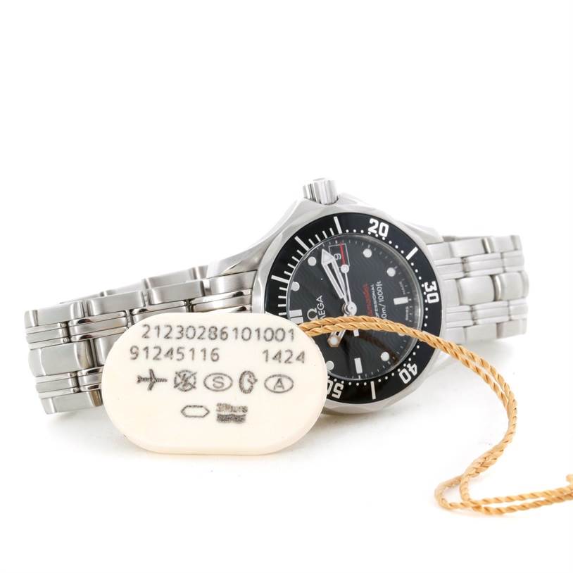 The image shows the Omega 212.30.28.61.01.001 Women
s Stainless Steel Black Dial 212.30.28.61.01.001 Women
s Stainless Steel Black Dial Seamaster Professional 300 M Ladies Watch model 212.30.28.61.01.001 at an angled side view with a tag.