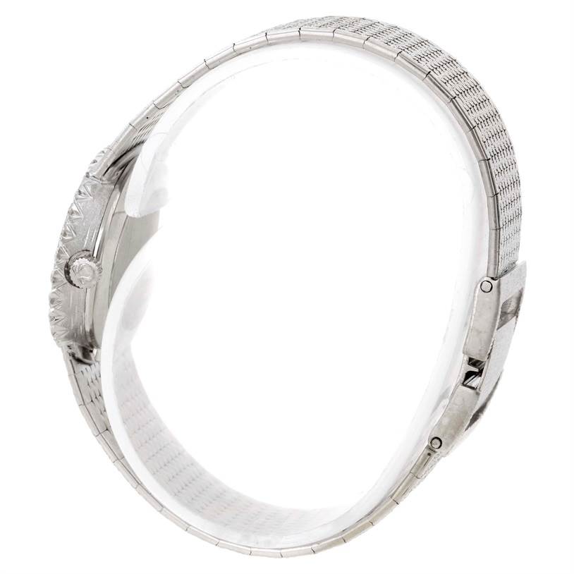 The image shows a side view of the Omega Women
s White Gold Silver Dial Women
s White Gold Silver Dial Vintage Ladies 18k White Gold 2 ct Diamond Cocktail Watch, highlighting the band and clasp.