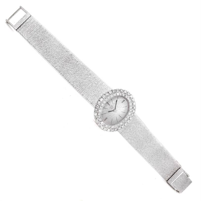The image shows an overhead view of the Omega Women
s White Gold Silver Dial Women
s White Gold Silver Dial Vintage Ladies 18k White Gold 2 ct Diamond Cocktail Watch, displaying the watch face and full strap.