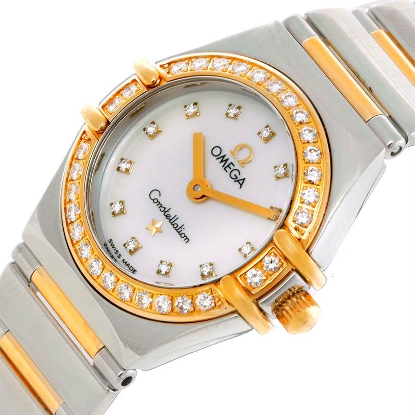 This image shows the dial, bezel, and part of the bracelet of the Omega 1365.71.00 Women
s Steel and Gold (two tone) Mother of Pearl Dial 1365.71.00 Women
s Steel and Gold (two tone) Mother of Pearl Dial Constellation Mini Steel Yellow Gold Diamond Watch 1365.71.00 model.