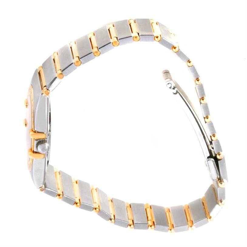 The image shows a side view of the Omega Women's Steel and Gold (two tone) Black Dial Women's Steel and Gold (two tone) Black Dial Constellation My Choice Mini Steel Gold Diamond Watch, highlighting its bracelet and case.
