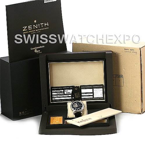 The image shows a Zenith Chronomaster 03.1260.4021/21.C505 Men
s Stainless Steel Black Dial 03.1260.4021/21.C505 Men
s Stainless Steel Black Dial watch inside its open box, with outer packaging and accessories visible.