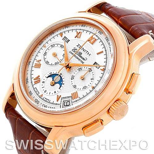 This Zenith Chronomaster 17.0240.410 Rose Gold Silver Dial 17.0240.410 Rose Gold Silver Dial watch is shown in a close-up at an angled view, highlighting its gold case, white dial, and brown leather strap.