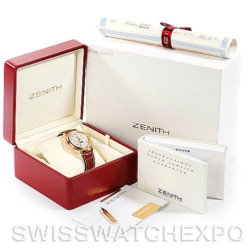 The image shows a Zenith Chronomaster 17.0240.410 Rose Gold Silver Dial 17.0240.410 Rose Gold Silver Dial watch at an angle inside its red box, with accompanying accessories including manuals and a cleaning cloth.