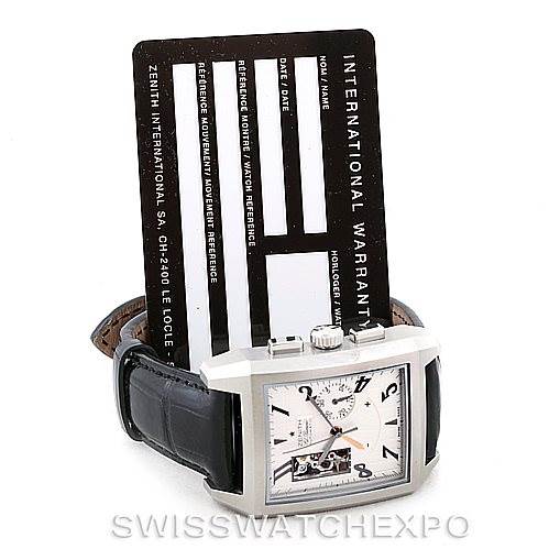 The image shows a Zenith Port Royal 03.0550.4021/01.C503 Men's Stainless Steel Silver Dial 03.0550.4021/01.C503 Men's Stainless Steel Silver Dial watch from a slightly elevated angle, accompanied by an international warranty card.