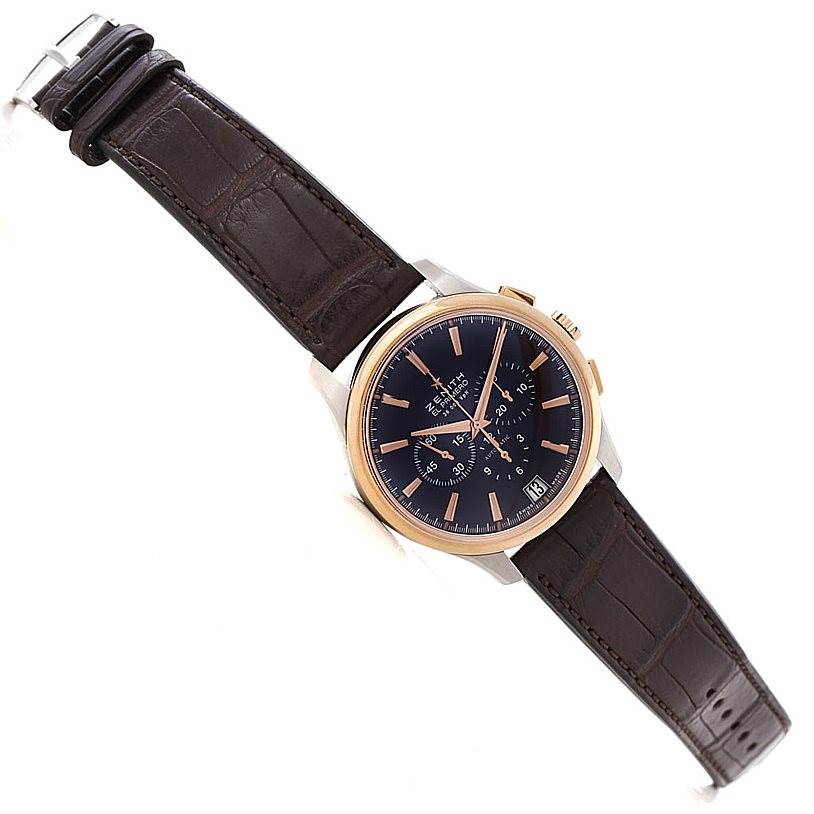 The Zenith Captain 51.2112.400 Men's Steel and Gold (two tone) Brown Dial 51.2112.400 Men's Steel and Gold (two tone) Brown Dial model watch is shown at an angle displaying its black dial, gold-tone bezel, chronograph subdials, date window, and dark leather strap.