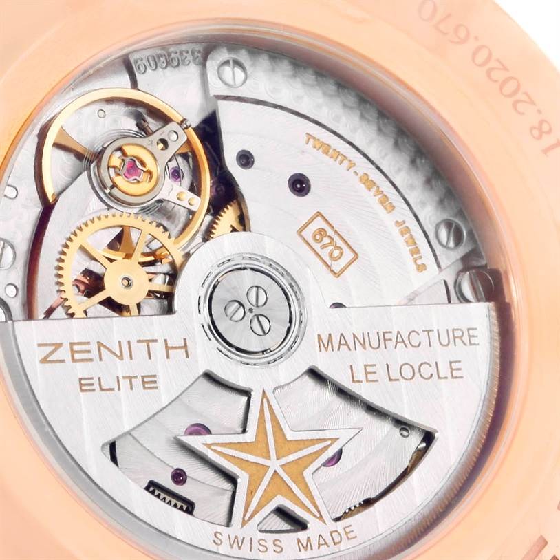The image shows a close-up view of the movement mechanism of the Zenith Captain 18.2020.670 Men's Rose Gold White Dial 18.2020.670 Men's Rose Gold White Dial model watch, highlighting the gears and inscriptions.