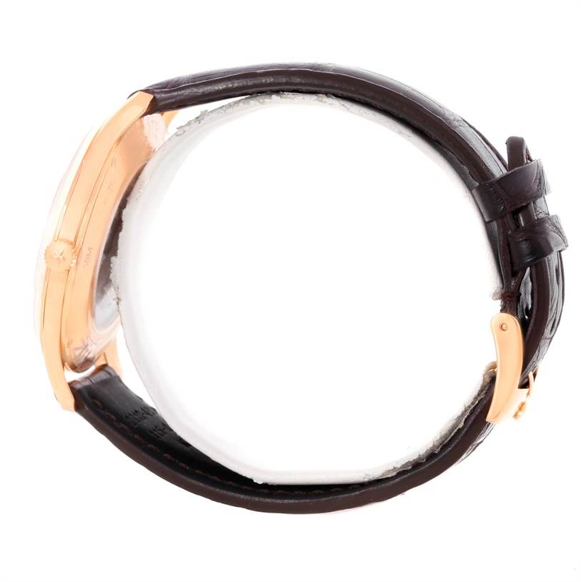 The photo shows a side view of the Zenith Captain 18.2020.670 Men's Rose Gold White Dial 18.2020.670 Men's Rose Gold White Dial model watch, highlighting the gold case, crown, and leather strap with buckle.