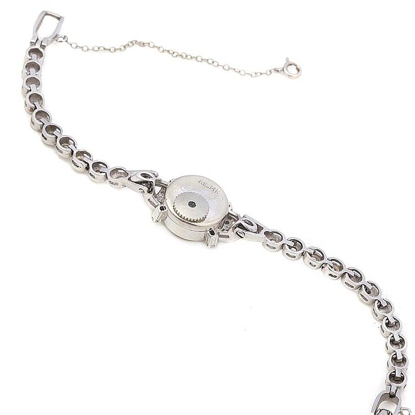 The image shows the back view of the Longines Women's White Gold Silver Dial Women's White Gold Silver Dial Vintage Ladies 14k w Gold Diamonds Watch model, focusing on the back cover and band.