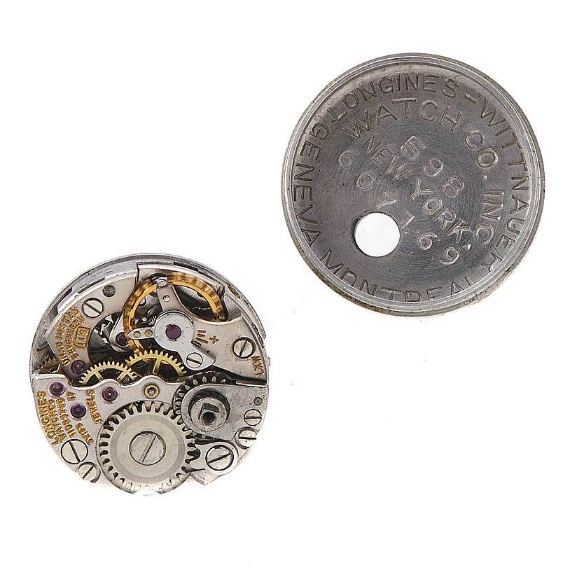 This image shows the internal mechanical parts of the Vintage Ladies 14k w Gold Diamonds Watch by Longines Women's White Gold Silver Dial Women's White Gold Silver Dial.