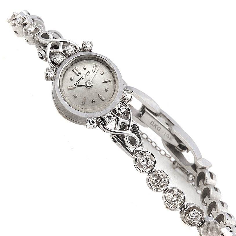 The image shows a Longines Women's White Gold Silver Dial Women's White Gold Silver Dial Vintage Ladies 14k White Gold Diamonds Watch from a top angle, highlighting its intricate band and diamond accents.