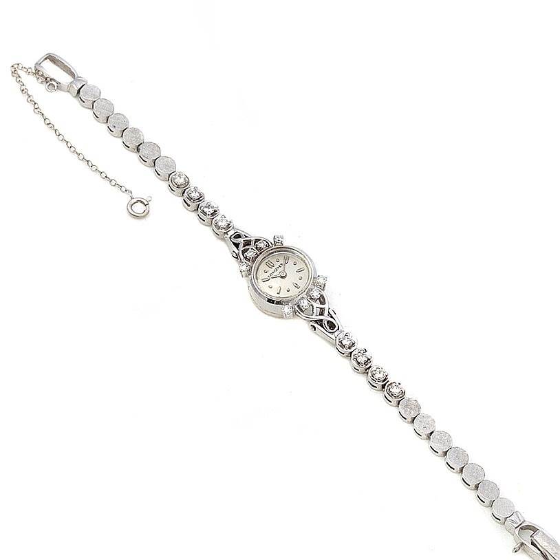 The image shows a top-down view of the Vintage Ladies 14k w Gold Diamonds Watch by Longines Women's White Gold Silver Dial Women's White Gold Silver Dial, highlighting the dial and bracelet.