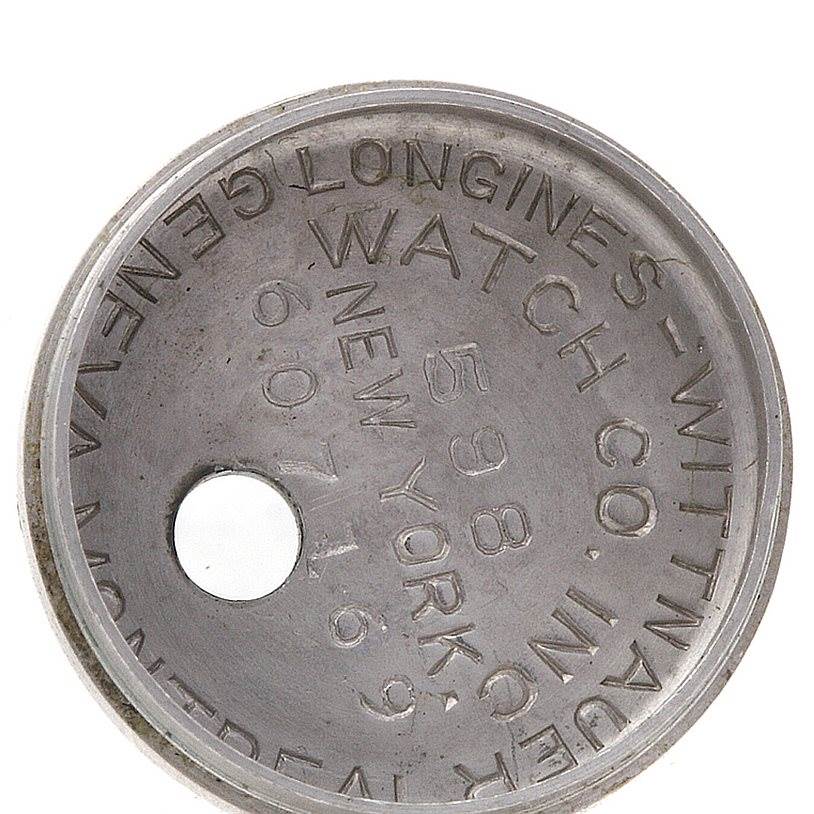 The image shows the inner case back of the Vintage Ladies 14k w Gold Diamonds Watch model by Longines Women's White Gold Silver Dial Women's White Gold Silver Dial.