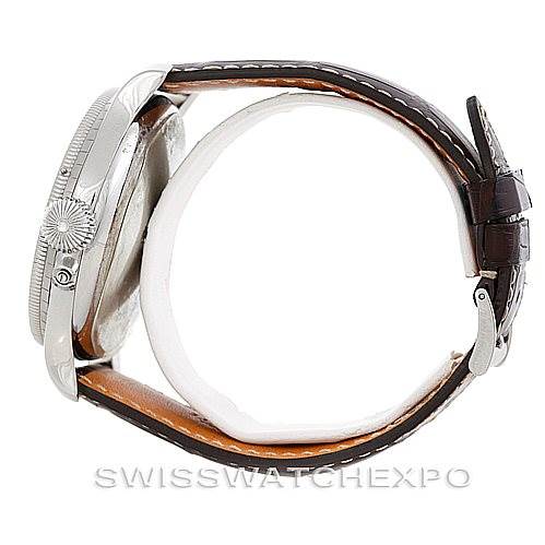 The image shows a side view of the Longines L2.678.4.11.0 Men's Stainless Steel Silver Dial L2.678.4.11.0 Men's Stainless Steel Silver Dial Heritage Lindberg Hour Angle Men's Watch L2.678.4.11.0, highlighting its case, crown, and leather strap.