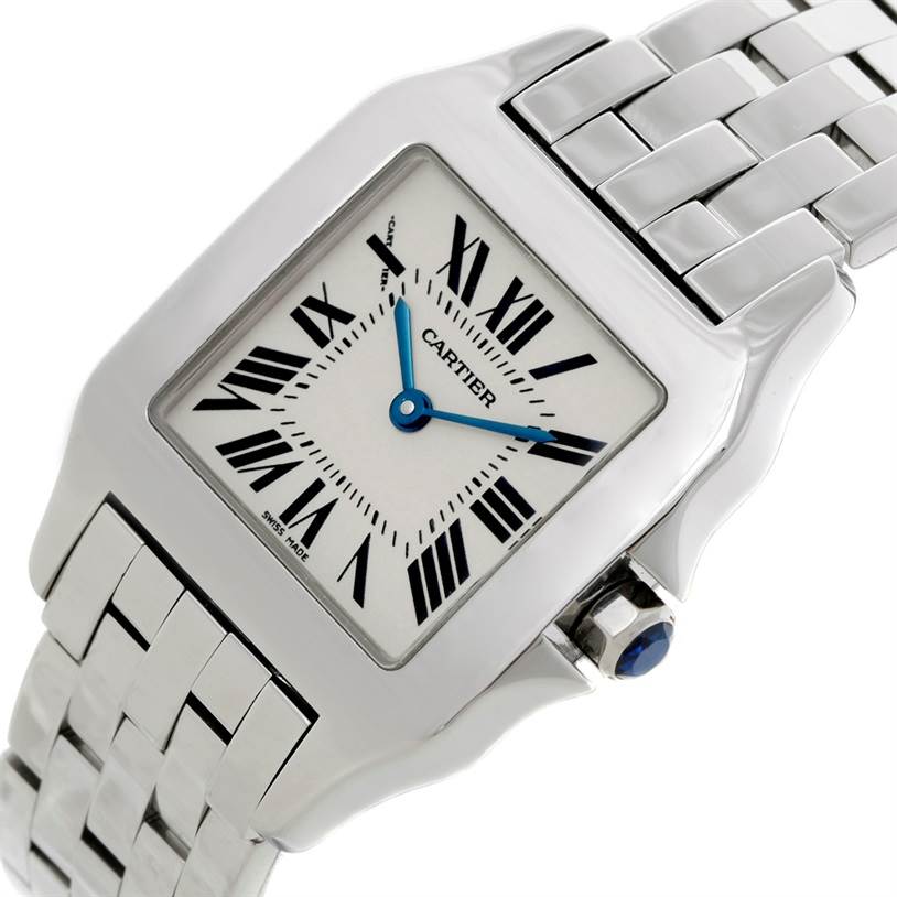 The image shows a close-up angle of the Cartier Santos Demoiselle W25065Z5 Women
s Stainless Steel Silver Dial W25065Z5 Women
s Stainless Steel Silver Dial watch, highlighting its face, bracelet, and crown with a blue cabochon.