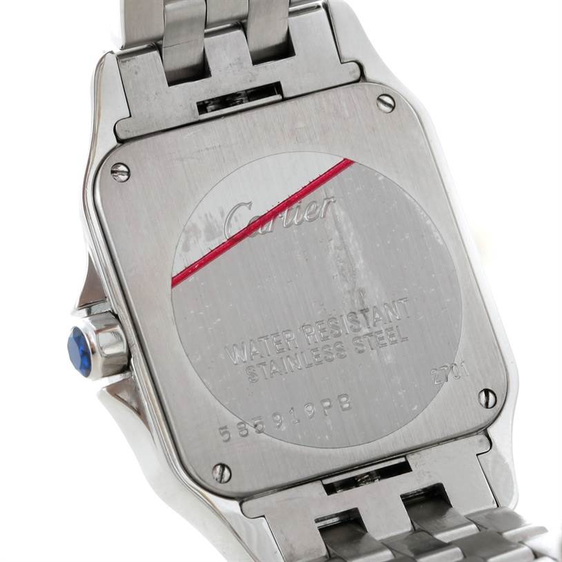 This image shows the back case of a Cartier Santos Demoiselle W25065Z5 Women
s Stainless Steel Silver Dial W25065Z5 Women
s Stainless Steel Silver Dial watch and part of its metal bracelet.