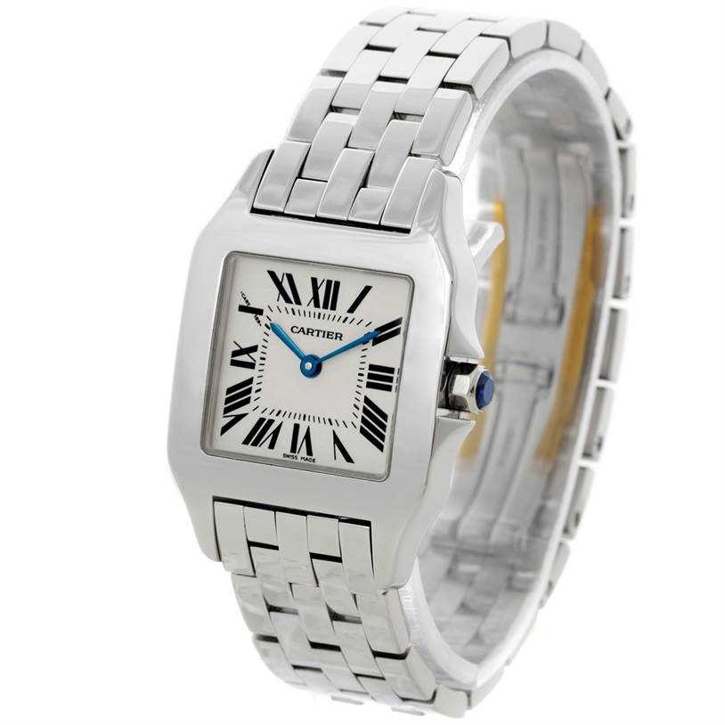 The image shows a frontal view of the Santos Demoiselle model by Cartier, featuring the face, blue hands, and part of the bracelet.