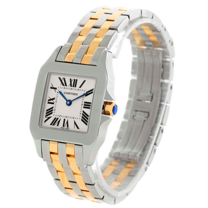 The image shows a Cartier Santos Demoiselle W25067Z6 Women's Steel and Gold (two tone) Silver Dial W25067Z6 Women's Steel and Gold (two tone) Silver Dial watch from an angled view, highlighting the face, bezel, and two-tone metal bracelet.
