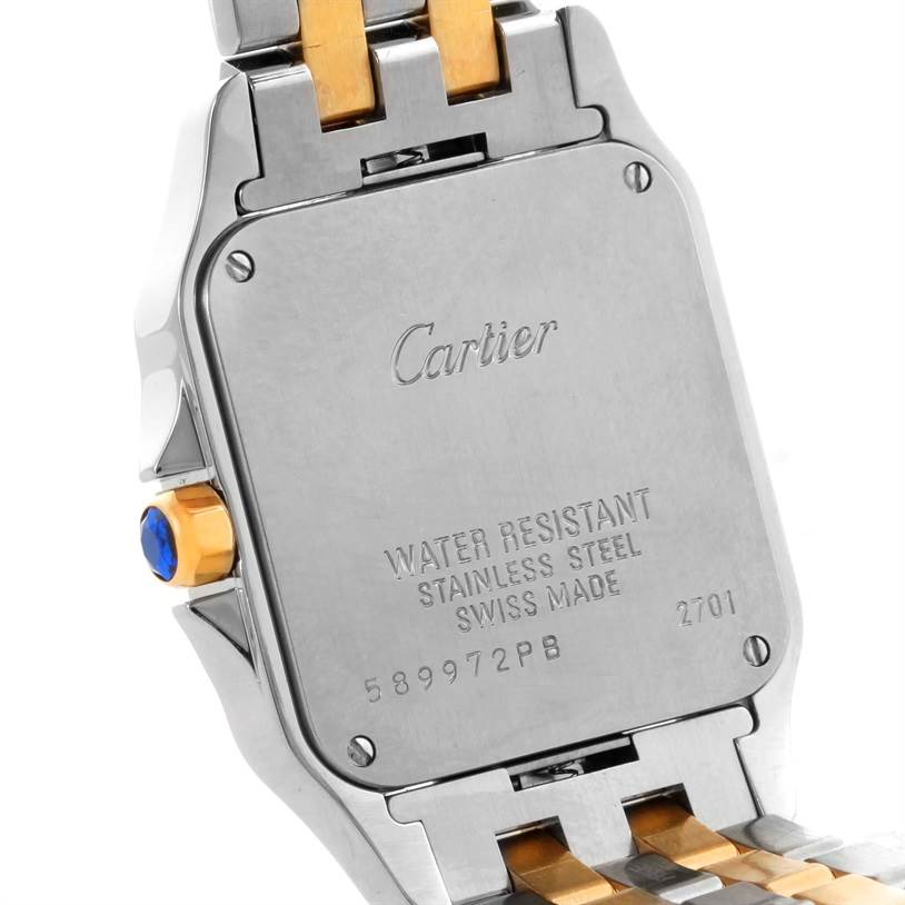 The image shows the back case and part of the bracelet of the Cartier Santos Demoiselle W25067Z6 Women's Steel and Gold (two tone) Silver Dial W25067Z6 Women's Steel and Gold (two tone) Silver Dial watch.