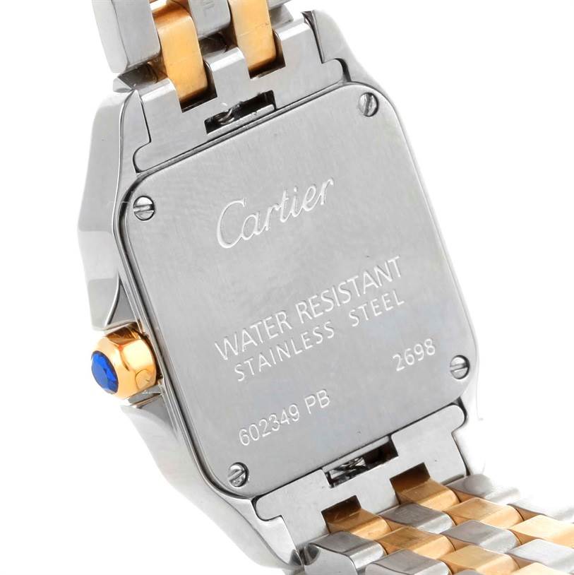 The image shows the back case and part of the stainless steel and gold bracelet of the Cartier Santos Demoiselle W25066Z6 Women's Steel and Gold (two tone) Silver Dial W25066Z6 Women's Steel and Gold (two tone) Silver Dial watch.