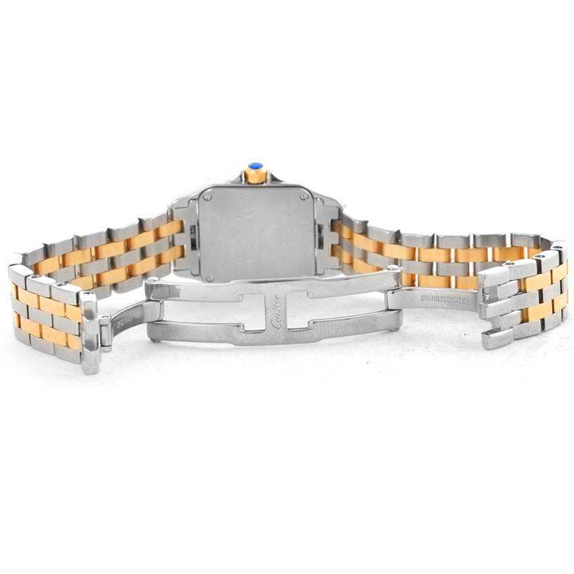 The image shows the back view of a Santos Demoiselle model by Cartier, including the case, crown, and two-tone bracelet with an open clasp.