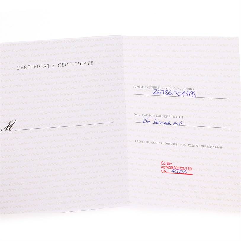 This is an image of the certificate for the Cartier Santos Demoiselle W25075Z5 Women's Stainless Steel Mother of Pearl Dial W25075Z5 Women's Stainless Steel Mother of Pearl Dial model, showing the individual number, purchase date, and dealer stamp.