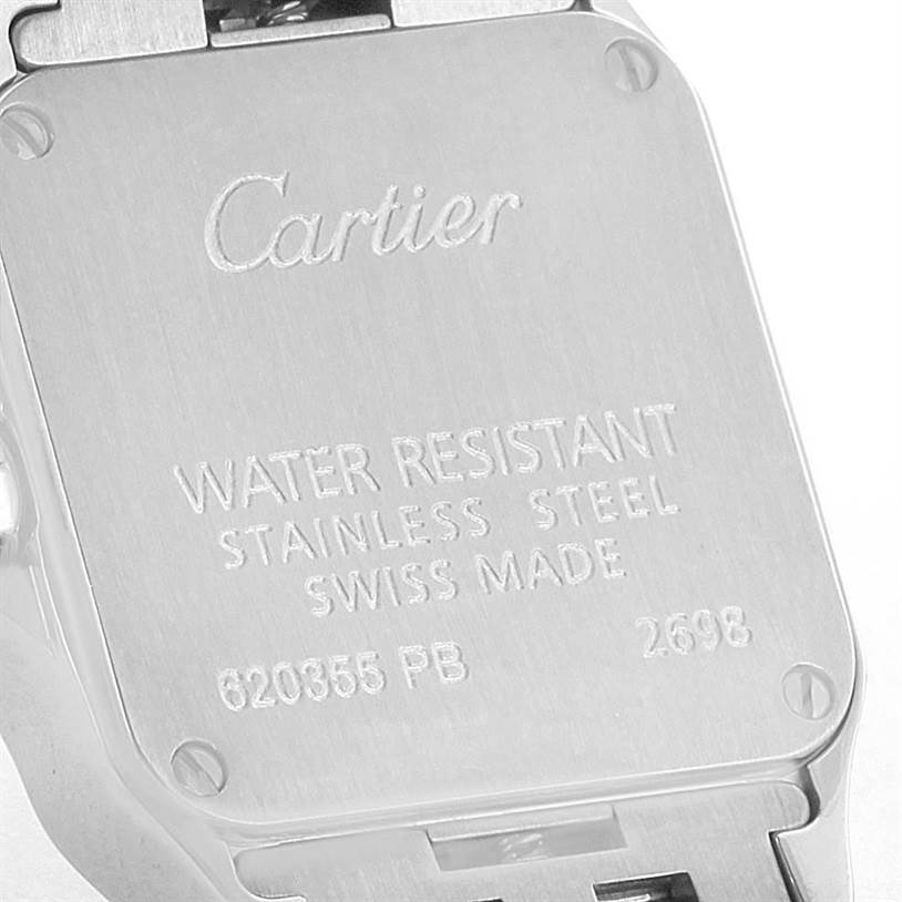 This is a close-up view of the back case of a Cartier Santos Demoiselle W25075Z5 Women
s Stainless Steel Mother of Pearl Dial W25075Z5 Women
s Stainless Steel Mother of Pearl Dial watch, featuring engraved details.