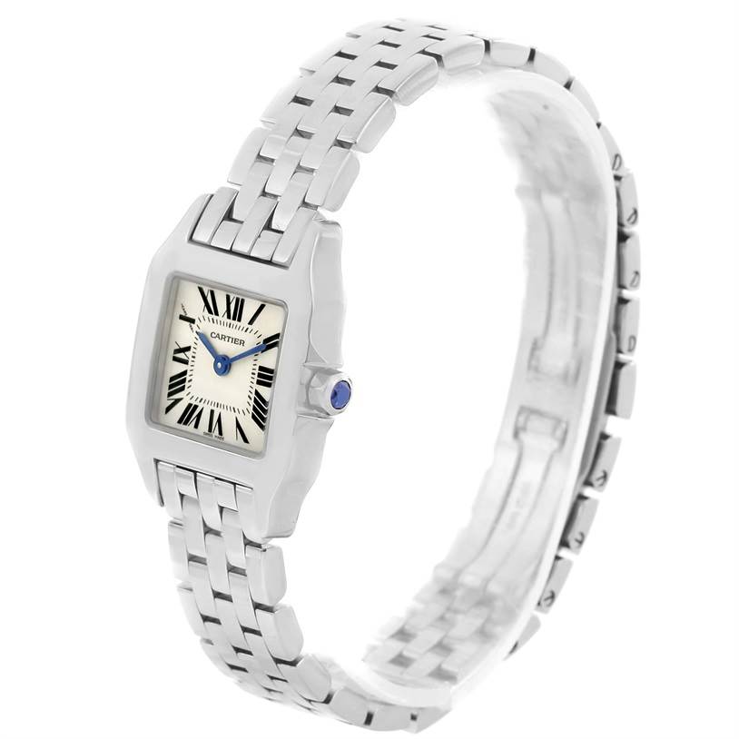 This image displays the Cartier Santos Demoiselle W25064Z5 Women's Stainless Steel Silver Dial W25064Z5 Women's Stainless Steel Silver Dial watch at a slight angle, showcasing its bracelet, face, and side with a decorative crown.