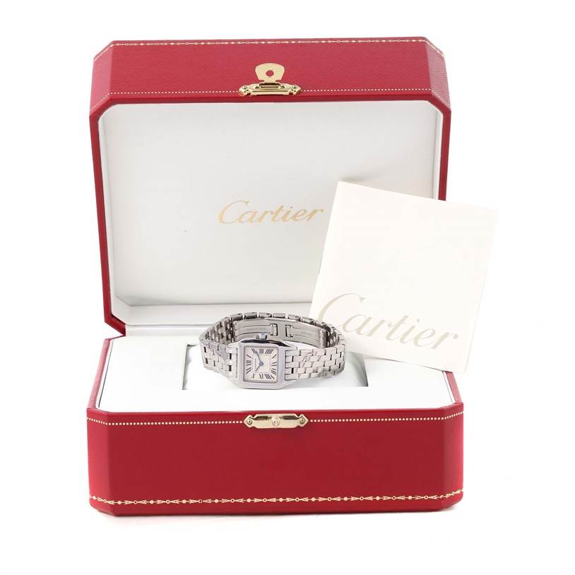 The Cartier Santos Demoiselle W25064Z5 Women's Stainless Steel Silver Dial W25064Z5 Women's Stainless Steel Silver Dial watch is shown inside its red box, along with a Cartier booklet.