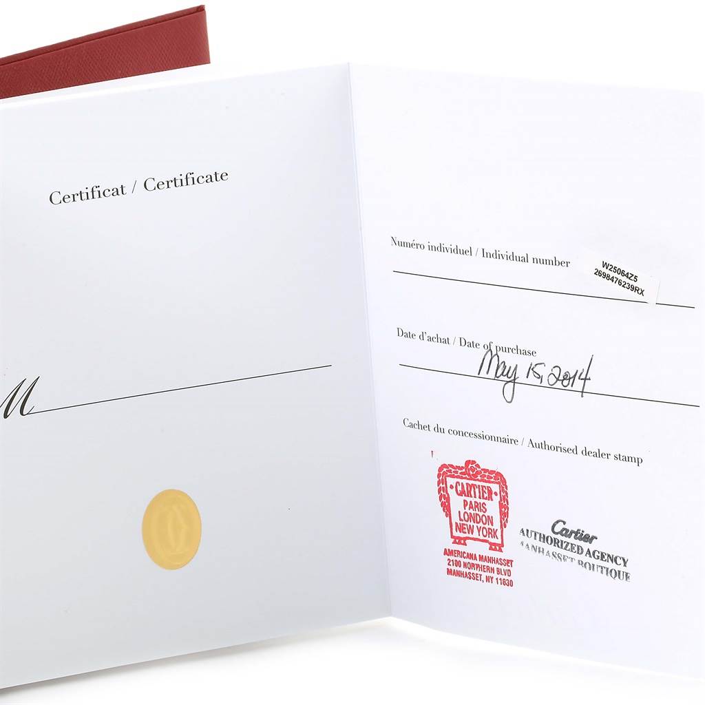 The image shows an open certificate booklet for a Santos Demoiselle model by Cartier, displaying the date of purchase and dealer stamps.