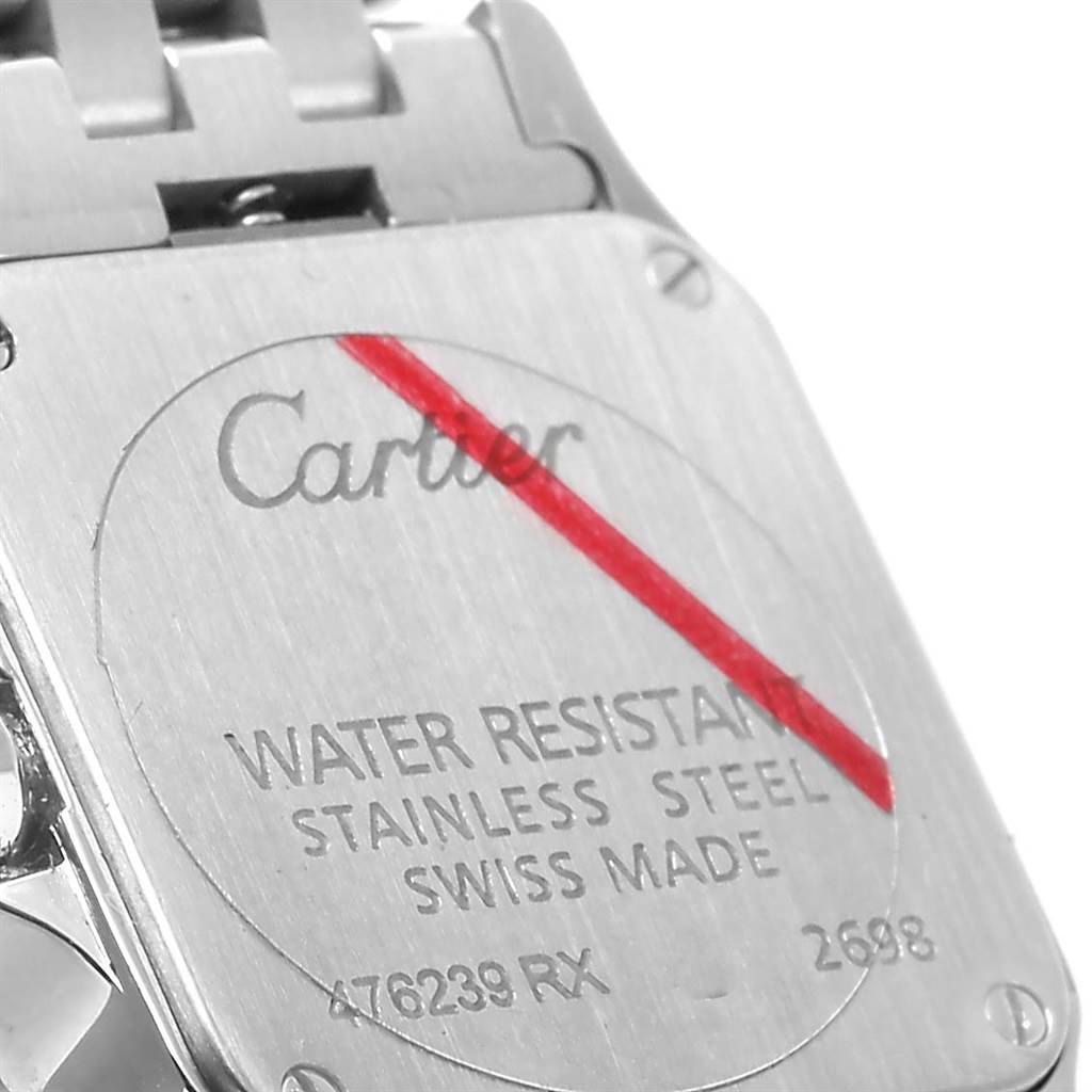 This close-up image shows the back case of the Santos Demoiselle watch by Cartier.