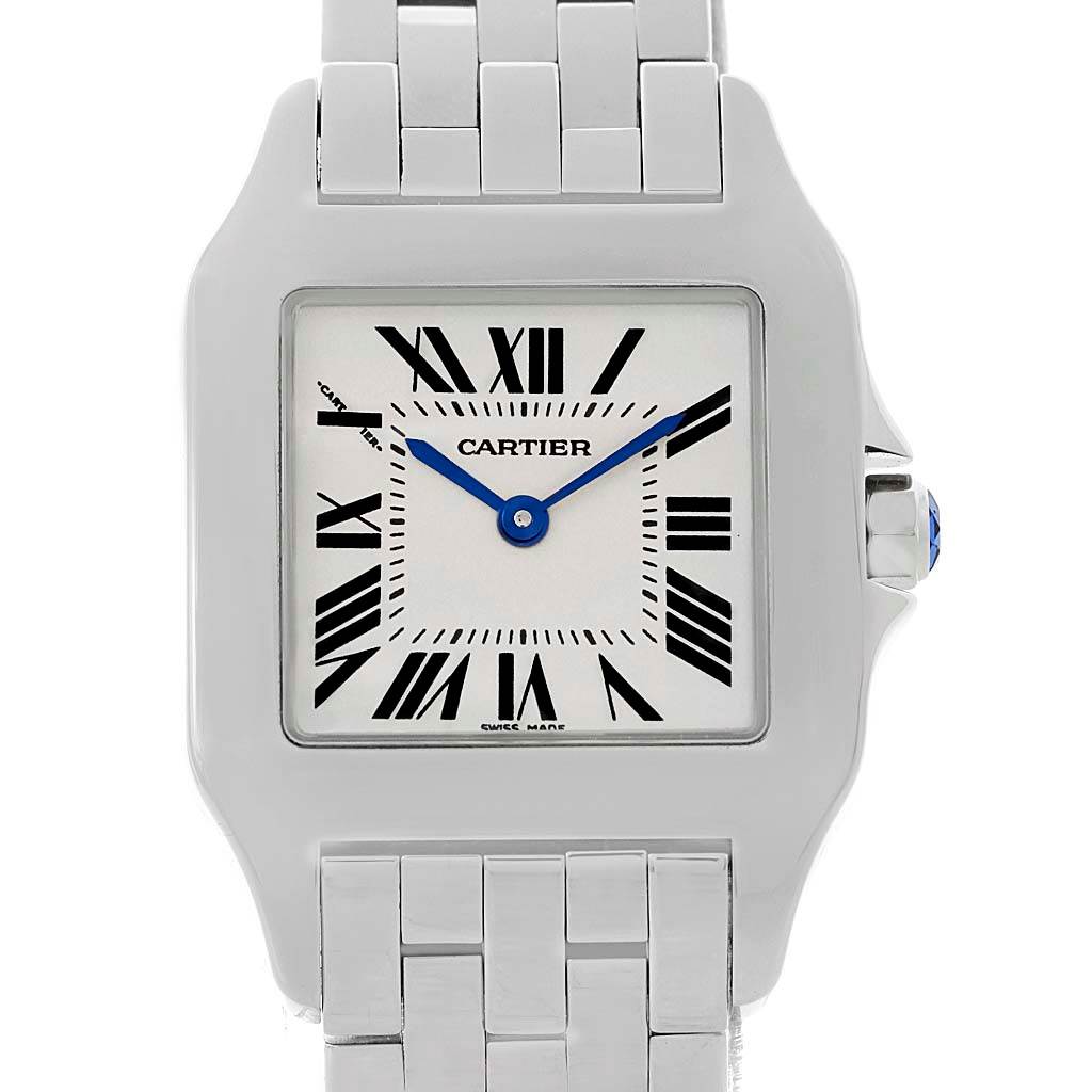 The image shows a frontal view of the Cartier Santos Demoiselle W25065Z5 Women's Stainless Steel Silver Dial W25065Z5 Women's Stainless Steel Silver Dial watch, featuring its dial, case, and part of its bracelet.