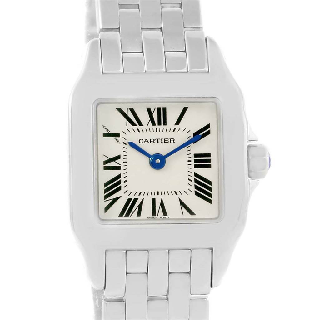 The Cartier Santos Demoiselle W25064Z5 Women's Stainless Steel Silver Dial W25064Z5 Women's Stainless Steel Silver Dial watch is shown from the front, displaying its square face, Roman numerals, and metal bracelet.