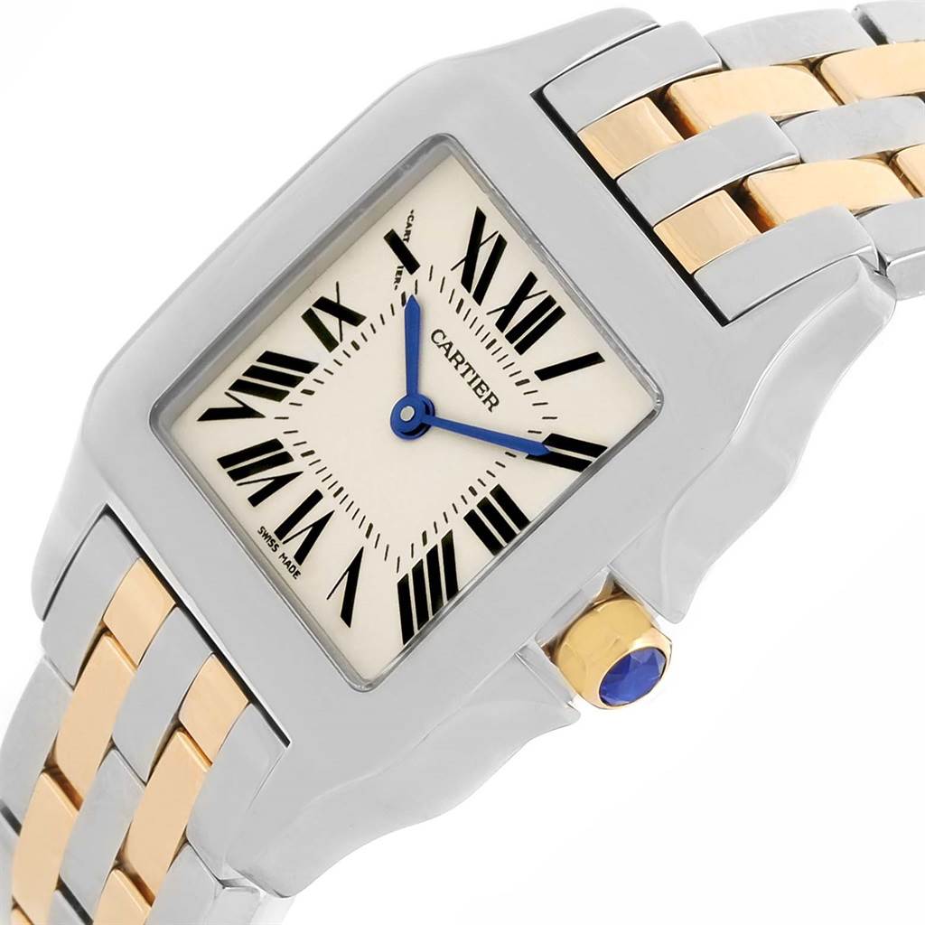 The image shows a close-up, angled view of the Cartier Santos Demoiselle W25067Z6 Women's Steel and Gold (two tone) Silver Dial W25067Z6 Women's Steel and Gold (two tone) Silver Dial watch, highlighting its face, dual-tone bracelet, and crown.