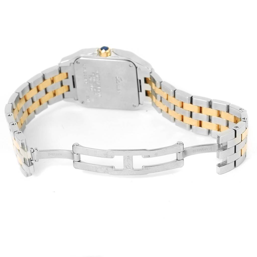This image shows the open clasp and case back of a Cartier Santos Demoiselle W25067Z6 Women's Steel and Gold (two tone) Silver Dial W25067Z6 Women's Steel and Gold (two tone) Silver Dial watch, highlighting its two-tone bracelet.